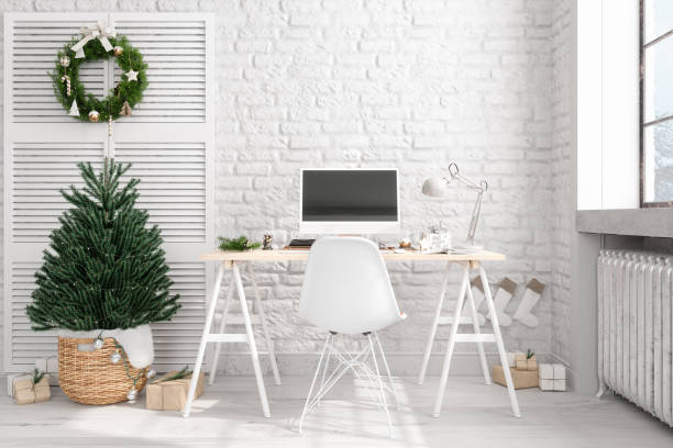 Modern Home Office Interior With Table, Desktop Computer, Brick Wall And Christmas Decoration