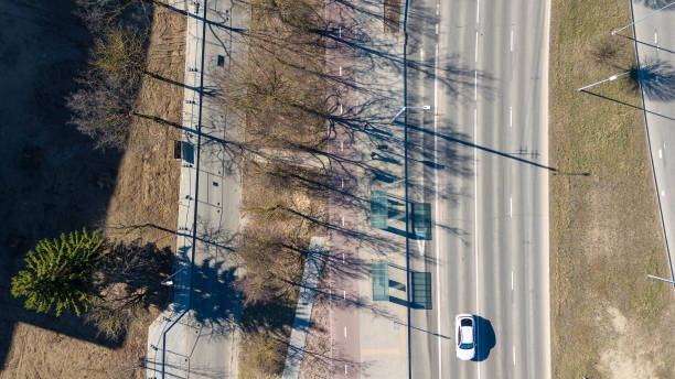 istock Aerial View of buss stop Multi-Lane Road with Tree Shadows 2178813062