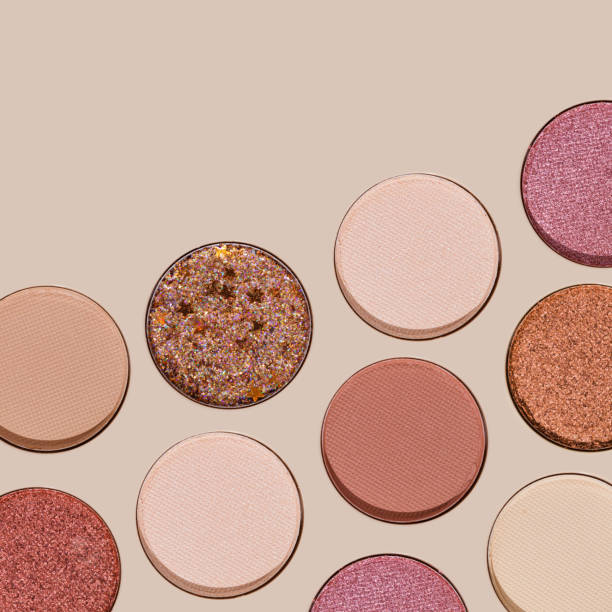 istock Colorful Swatches eyeshadow refills as minimal geometric pattern. Matte and glitter pans red brown pink shade with sun shadows, detail texture, cosmetic, beauty product, makeup, warm color scheme 2178815850
