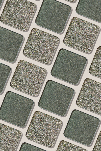istock Cosmetics texture pattern, makeup palette dark green silver gray eye shadow, eye powder swatches on beige background. Female cosmetic, beauty product, aesthetic minimal beauty, shimmer eyeshade 2178815881