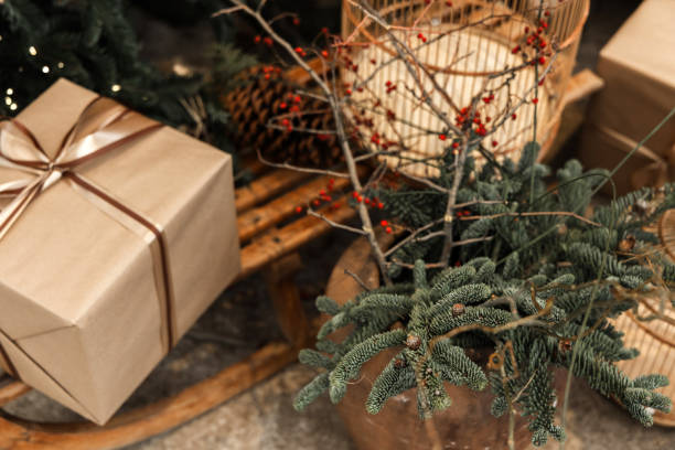 istock composition from christmas tree,pink balls,sleigh, birth cage and gift box under branches. 2178816128