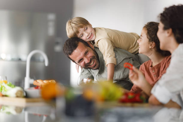 istock Happy family having fun together in the kitchen. 2178816658