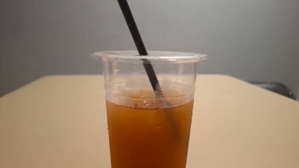 Sweet tea in a clear glass cup with ice cubes