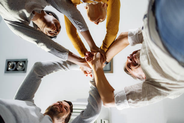 istock Below view of happy business team uniting their hands. 2178817255