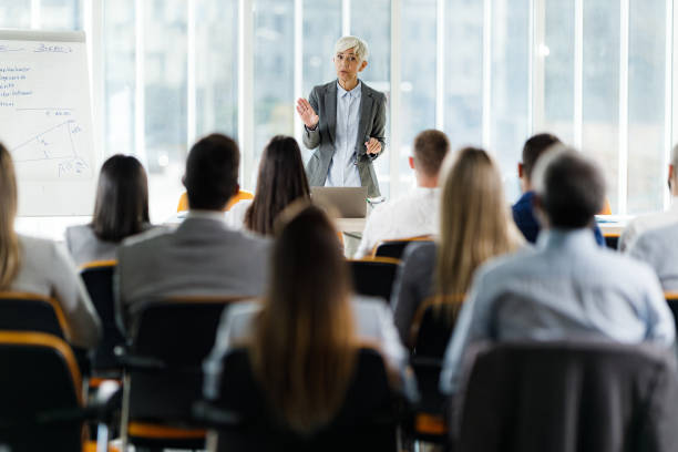 istock Mature business leader talking on a presentation in board room. 2178817403