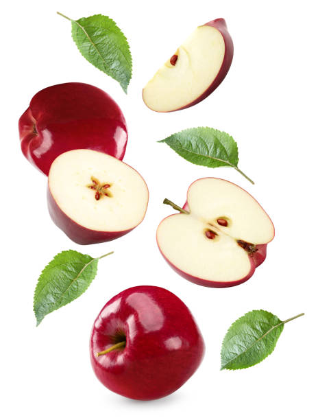 istock flying red apples with green leaves isolated on white background. clipping path 2178819400