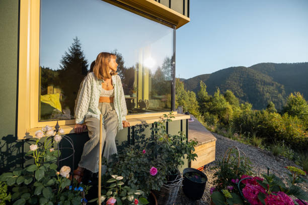 istock Woman Relaxing by Window in Garden 2178821354