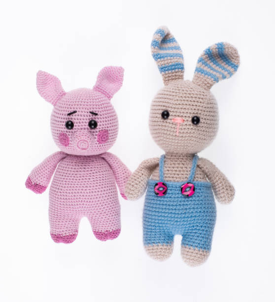 istock knitted toy pig and rabbit isolated on white background 2178821377
