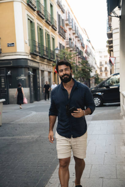 istock Smiling Man Walking on a City Street 2178821702