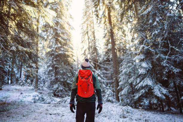 Man hiking in snowy conditions.