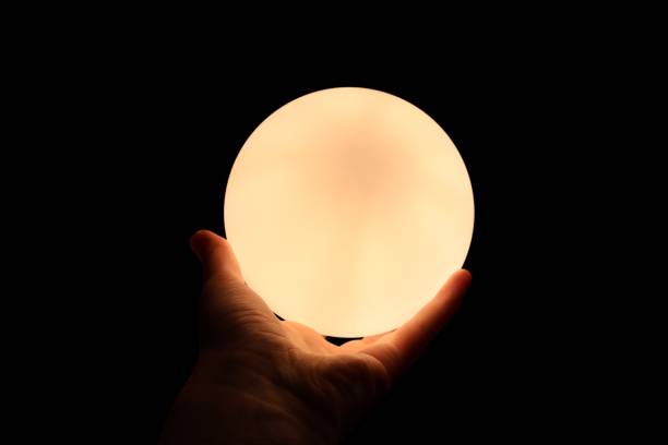istock Hand Holding a Glowing Orb in Darkness 2178827411