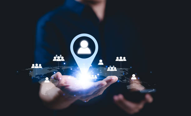 istock CRM concept. Customer relationship management technology. Businessman holds digital network user icons on global map, customer relationship management, global networking, customer targeting, map pin, 2178827539