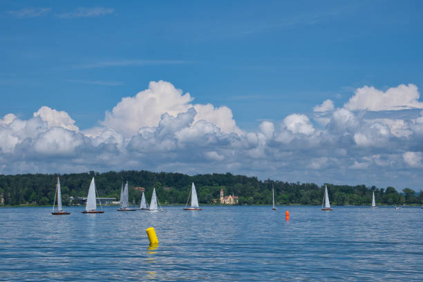 Several sailboats on the water