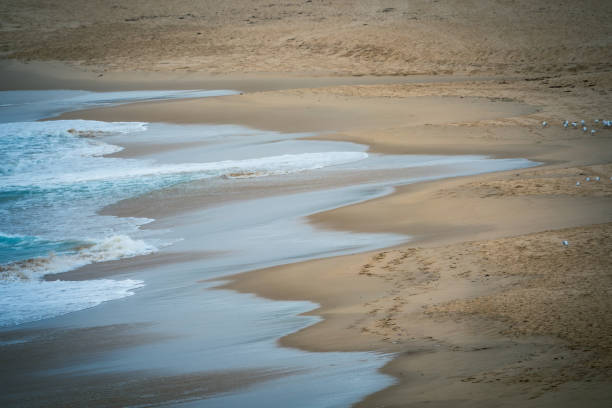 Seascape with beach and waves in Aude. Intense lights in Occitania