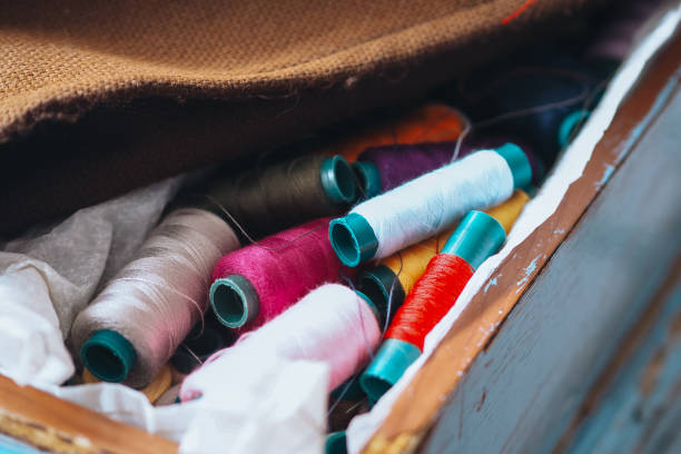 istock selective focus sewing equipment or sewing kit such as thread in various colors, placed in a container 2178831443