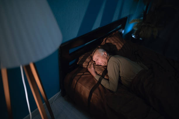 istock Above top view elderly mature man sleeping on soft pillow under blanket, dreams at night. Aged grandfather lying on side in comfortable bed. 2178832394
