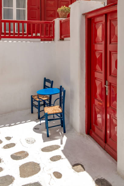 A blue wooden chair on the blue painted floor of the ferry