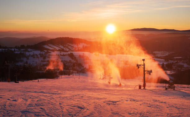 istock Snowmaker producing snow in a ski resort. Snowjet in side light and with dark background at sunset 2178834677