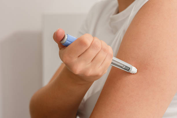 istock Woman injecting semaglutide in her arm. 2178836230