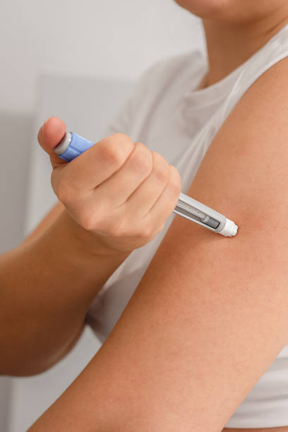 istock Woman injecting semaglutide in her arm. 2178836335