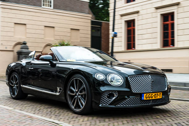Bentley Continental GT V8 Convertible car driving on the street in Zwolle during a charity event.