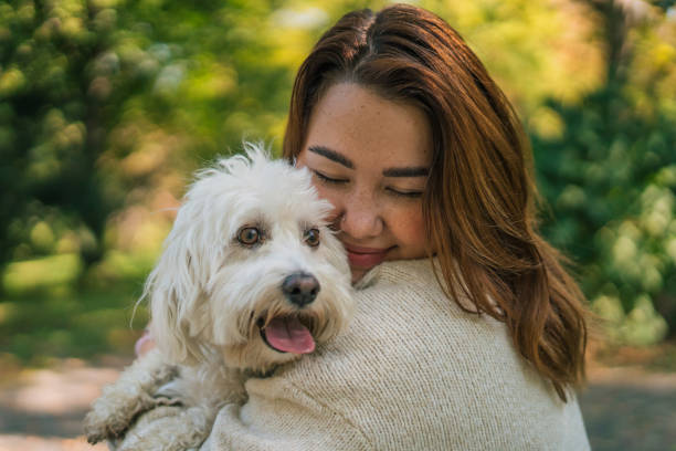 istock Young woman with dog, nature background 2178837036