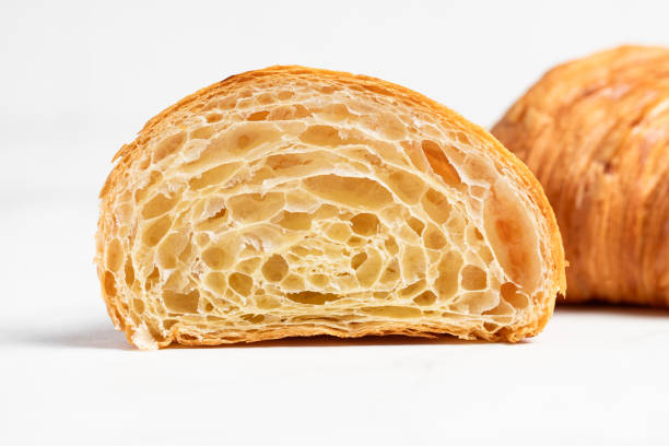 istock Cut in Half Croissant with Inside Texture and Thin Crisp Layers. Delicious French Pastry. Light background. 2178837067