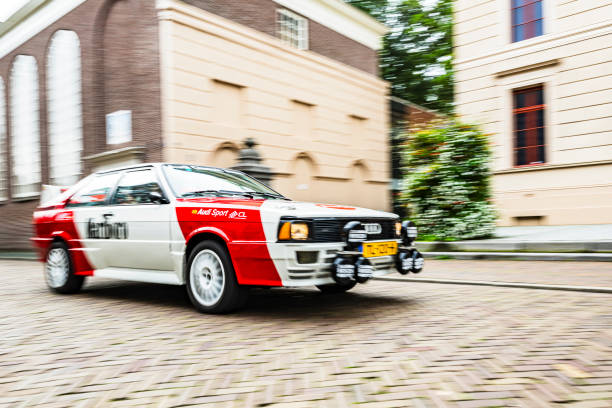 Audi Coupe Quattro rally car driving on the street in Zwolle during a charity event.