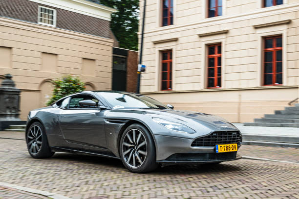 Aston Martin DB11 sports car driving on the street in Zwolle during a charity event.