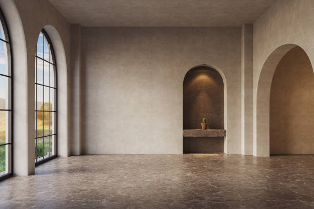 istock The room features arched walls and windows with neutral stucco walls, illuminated by warm yellow lights, 3d render 2178841452
