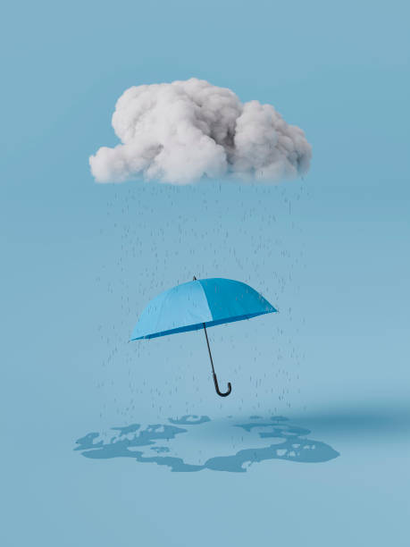 istock Blue umbrella protecting from rain coming from a cloud on blue monday 2178843075