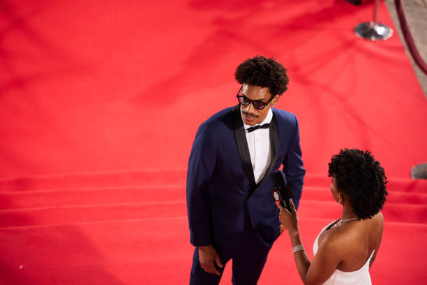 During a red carpet TV interview, the leading actor discuss their experiences and upcoming projects.