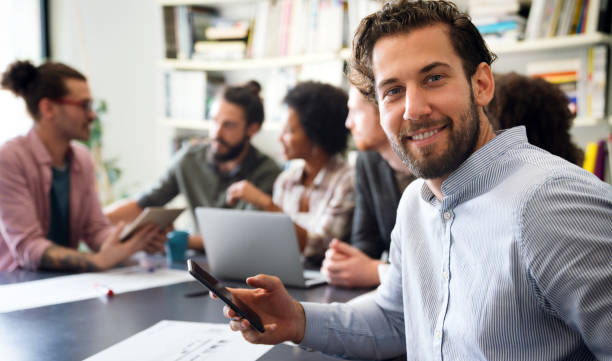 istock Team of multiethnic diverse young software developers talk, discuss an AI project. Business startup 2178843461