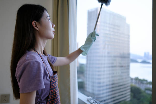 istock Asian woman cleaning window glass 2178848099