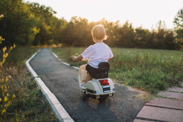 istock Little Explorer: Scooter Ride Through the Park 2178848137