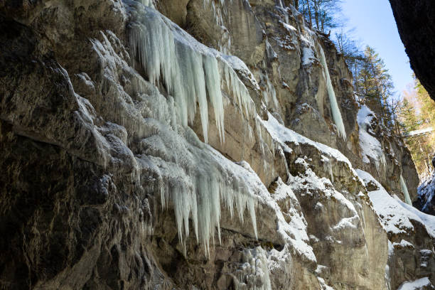 A waterfall frozen in the cold winter. mountain cliffs