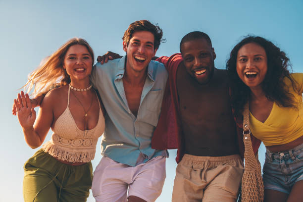 istock Group of happy friends at the beach 2178853533