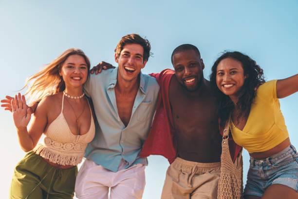 istock Group of happy friends at the beach 2178853568