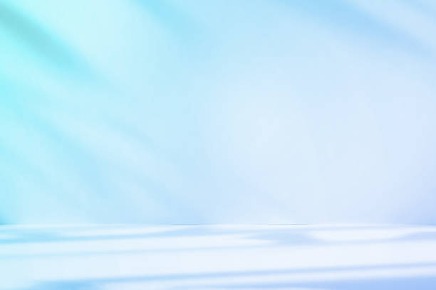 istock Abstract blue color gradient studio background for product presentation. Empty room with shadows of window and flowers and palm leaves . 3d room with copy space. Summer concert. Blurred backdrop. 2178854120