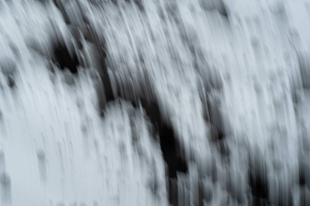Black ink splashingBlack ink splashing on a dark backgroundBlack ink splashing on a dark background