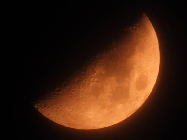 istock moon in the first quarter phase seen through the mist 2178854854