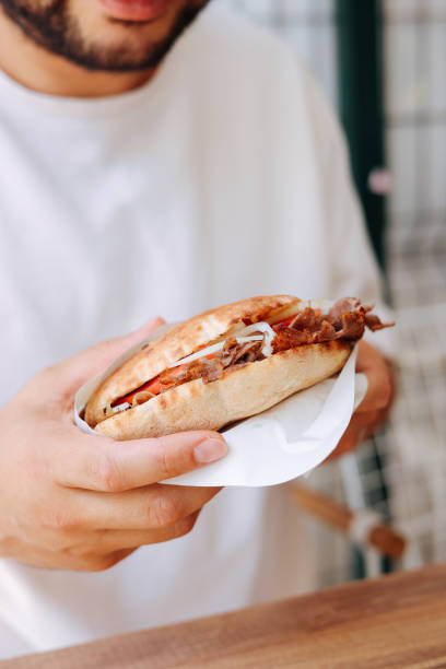 istock Young men eating  Doner Kebap fast food 2178854935