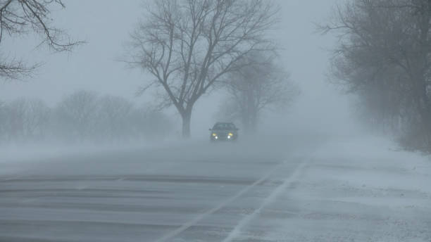 istock Cars on winter road at blizzard 2178855297