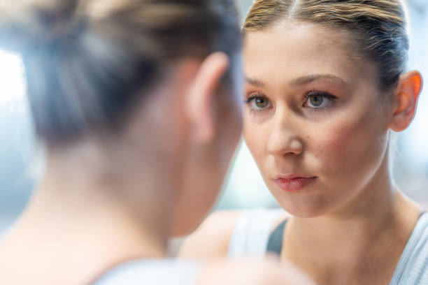 istock Gymnast woman looking in mirror 2178856823