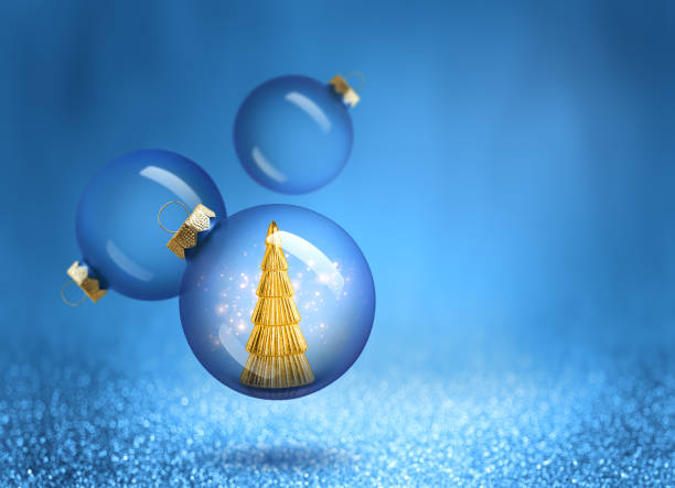 istock Christmas bauble with gold tree decoration inside. New Year ornaments on blue sparkling background. 2178858313