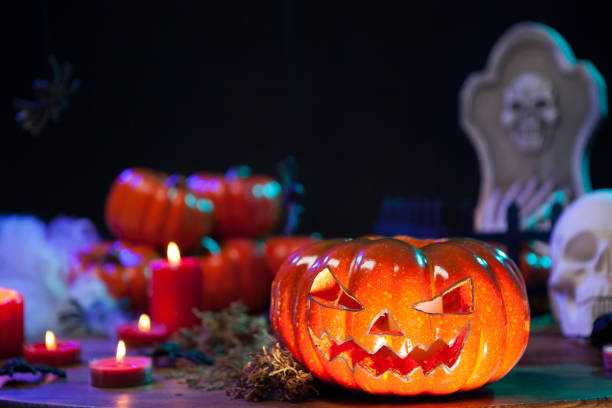 istock Haunted orange pumpking on halloween celebration table 2178859793