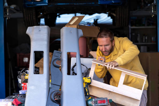 istock Man Measuring Wooden Frame with Square Ruler in Garage 2178859863