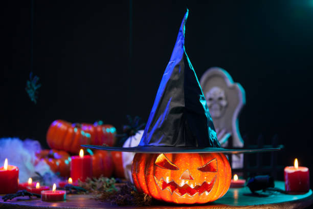 istock Haunted witch pumpking with a big black hat at halloween celebration 2178859949