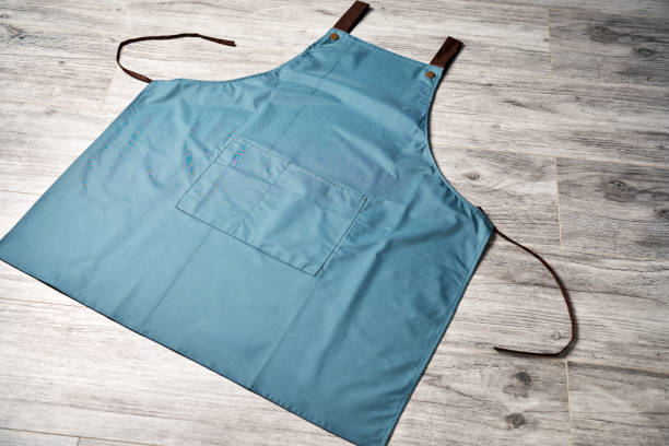istock Blue kitchen apron background with copy space. Chef black apron, top view 2178860000