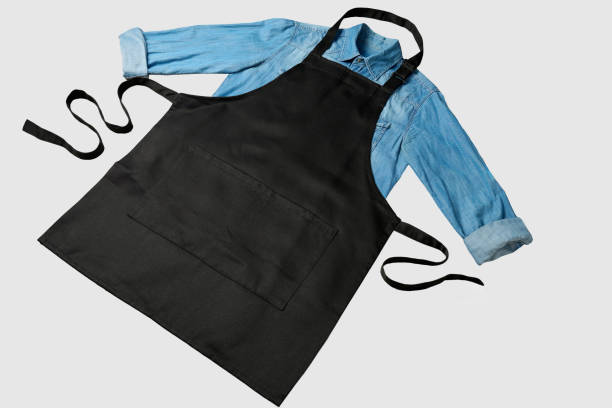 istock Black apron and shirt on a white background with copy space. Chef black apron, top view 2178860006